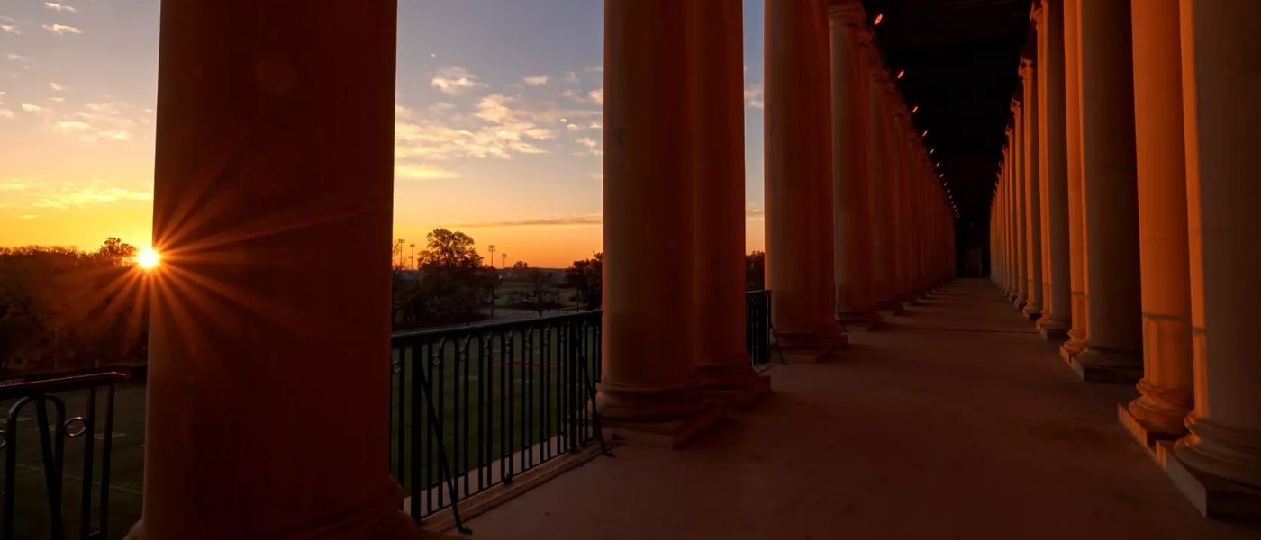 The colonnades of Memorial Stadium at sunrise